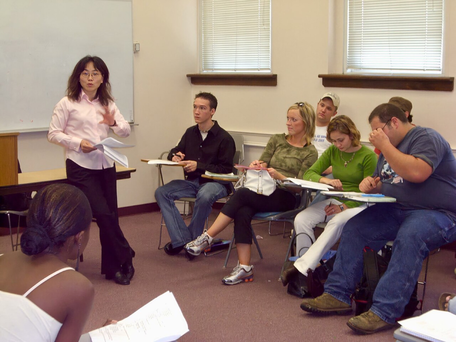 Instructor teaching a classroom of adult students